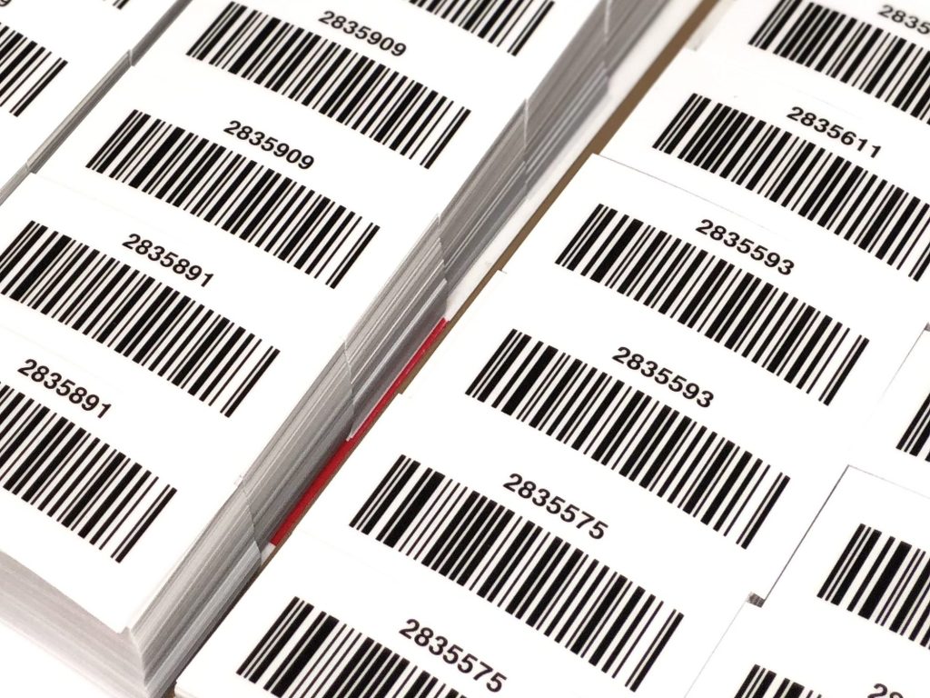 220 PVC-encapsulated barcodes, individually cut and intended for application to pallets for stock distribution.